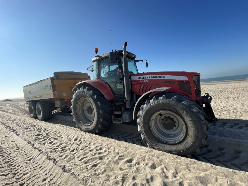 The other 30-40% of time the tractor spends on the beach unloading the sand back to the coast
